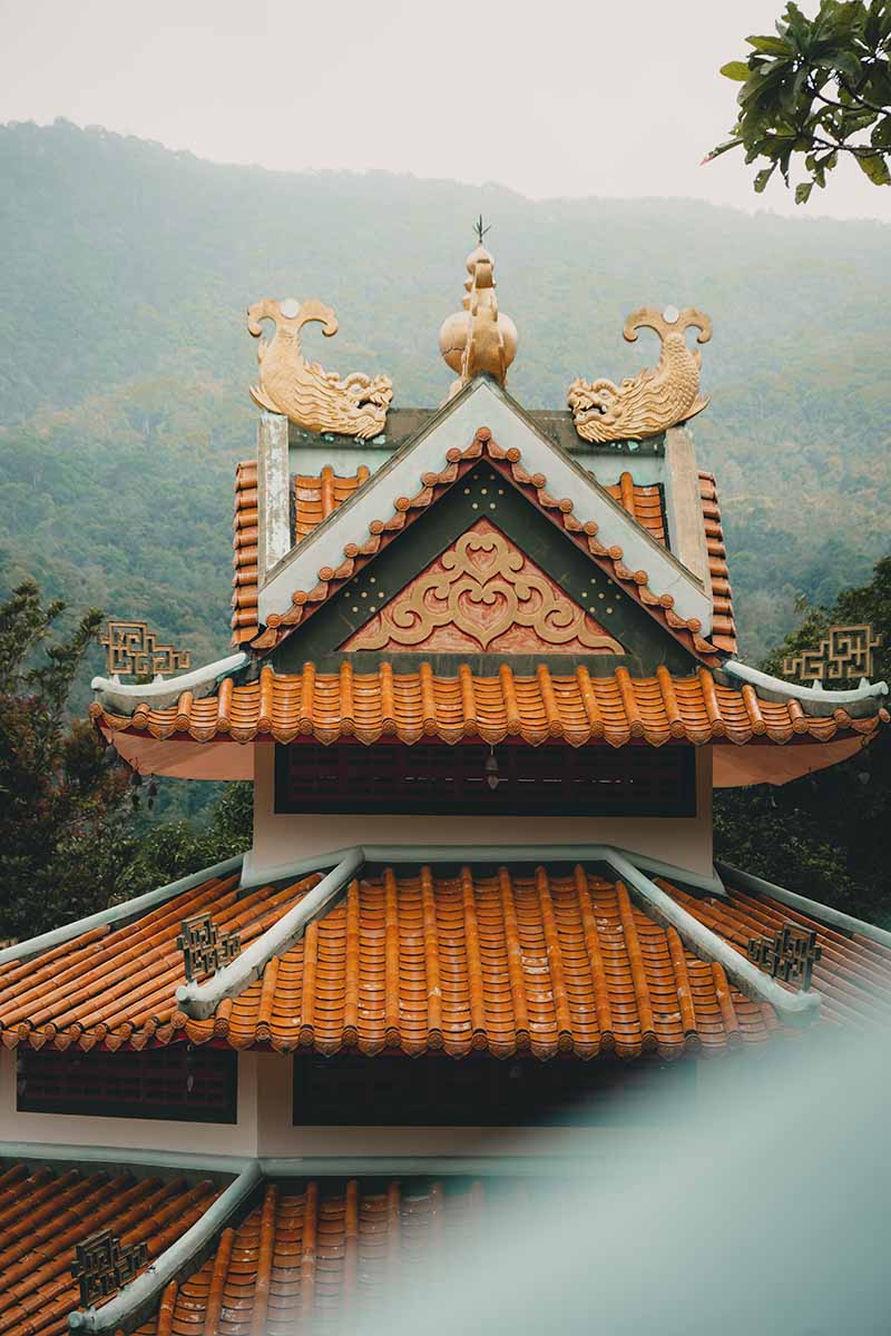 The orange-tiled and tiered roof of the Chinese Temple.