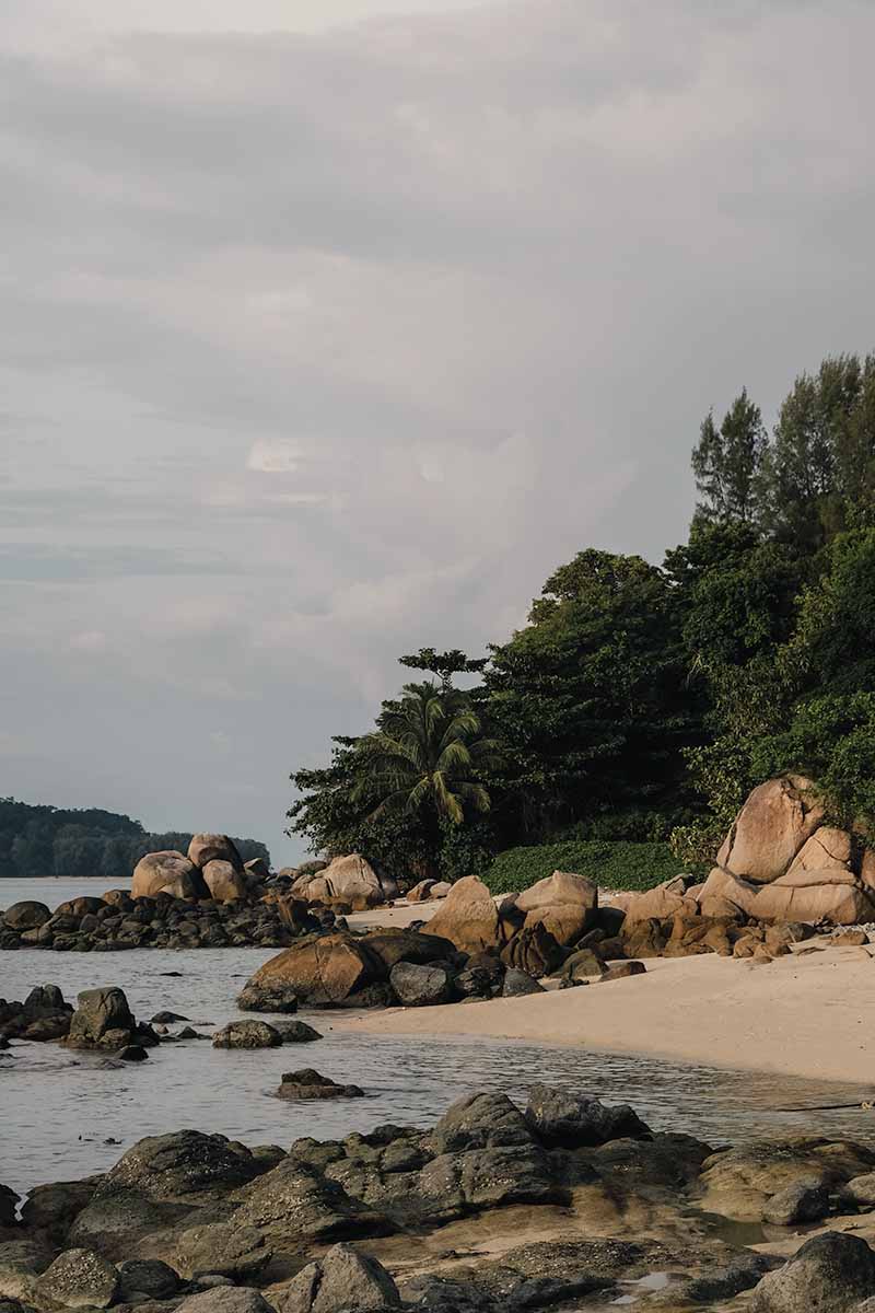 Two small bays and coastal boulders along Koh Lipe's northwest coast.