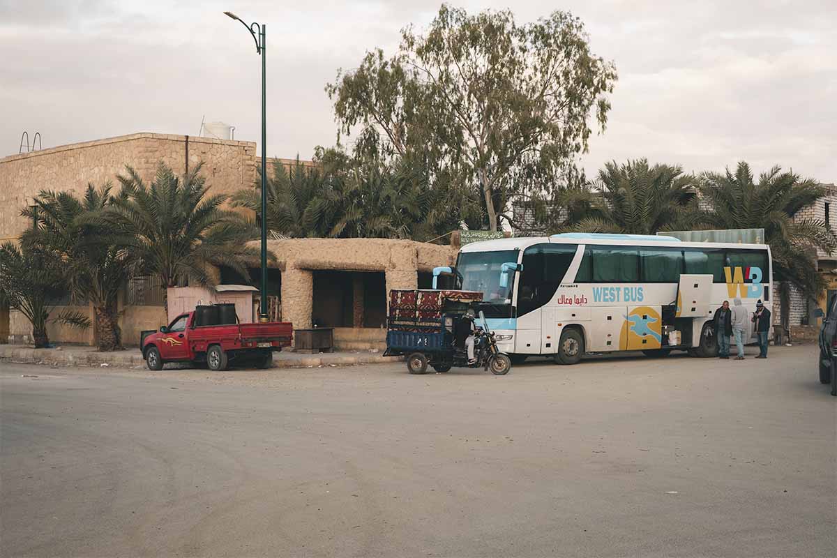 Luggage being loaded onto a West Delta bus outside Siwa Bus Station.