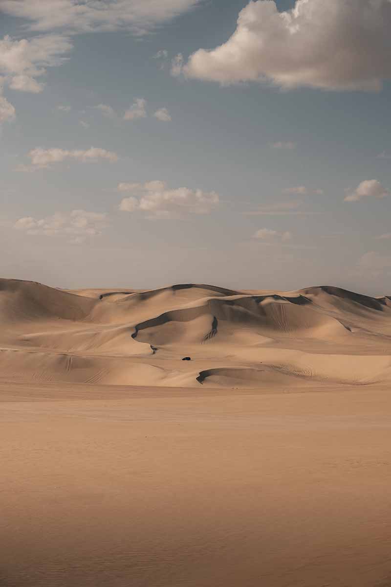 Distant, large sand dunes of the Great Sand Sea.