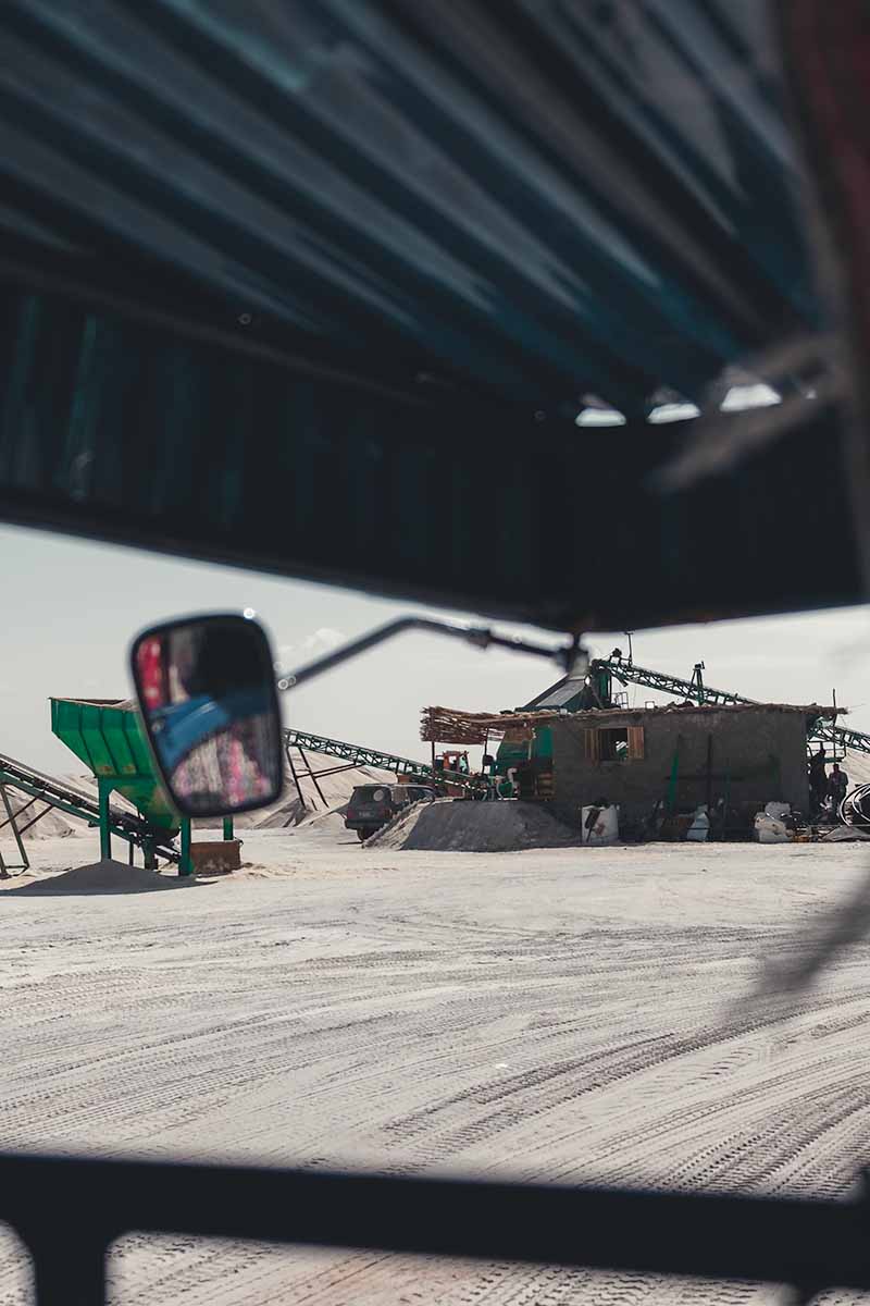 The machinery of Siwa Salt Group's mine as seen from the inside of a tuk-tuk.