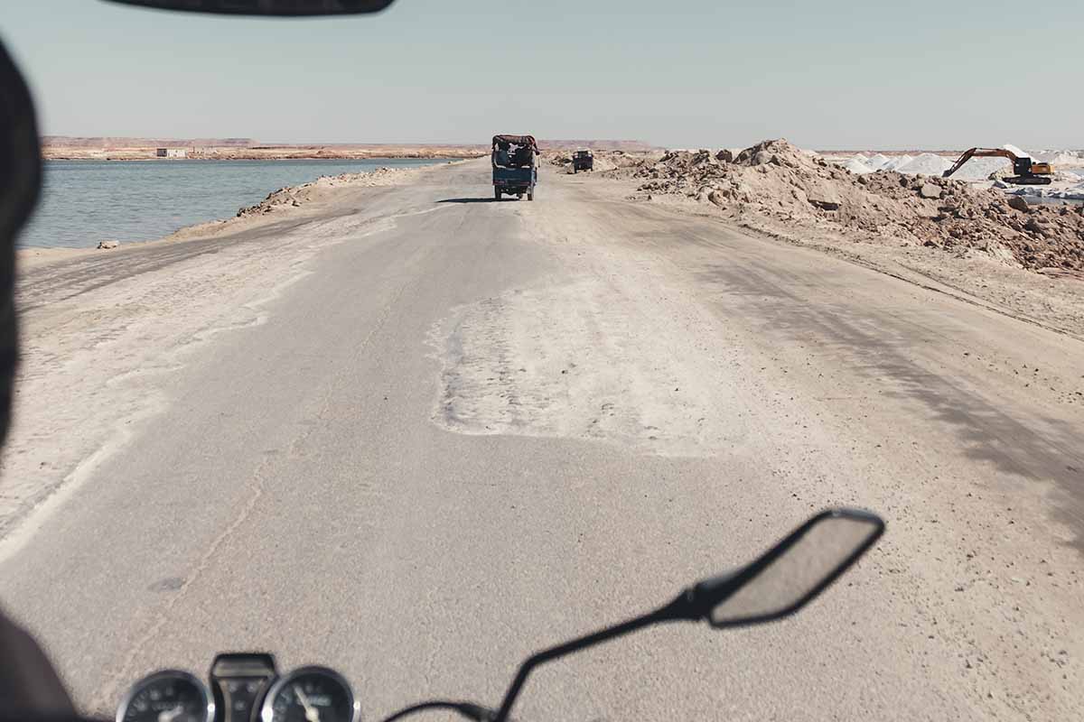 A tuk tuk on the road heading towards the Siwa Salt Lakes.