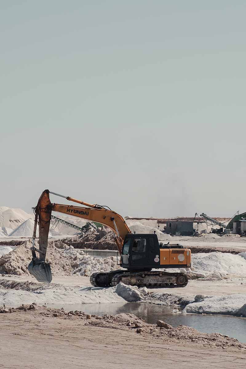 A large digger excavating rock salt.