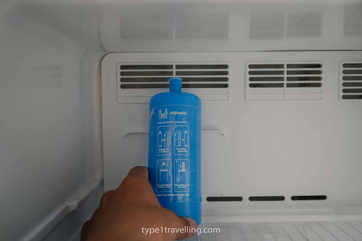 A hand reaching into a freezer for a 4ALLFAMILY biogel cold pack.