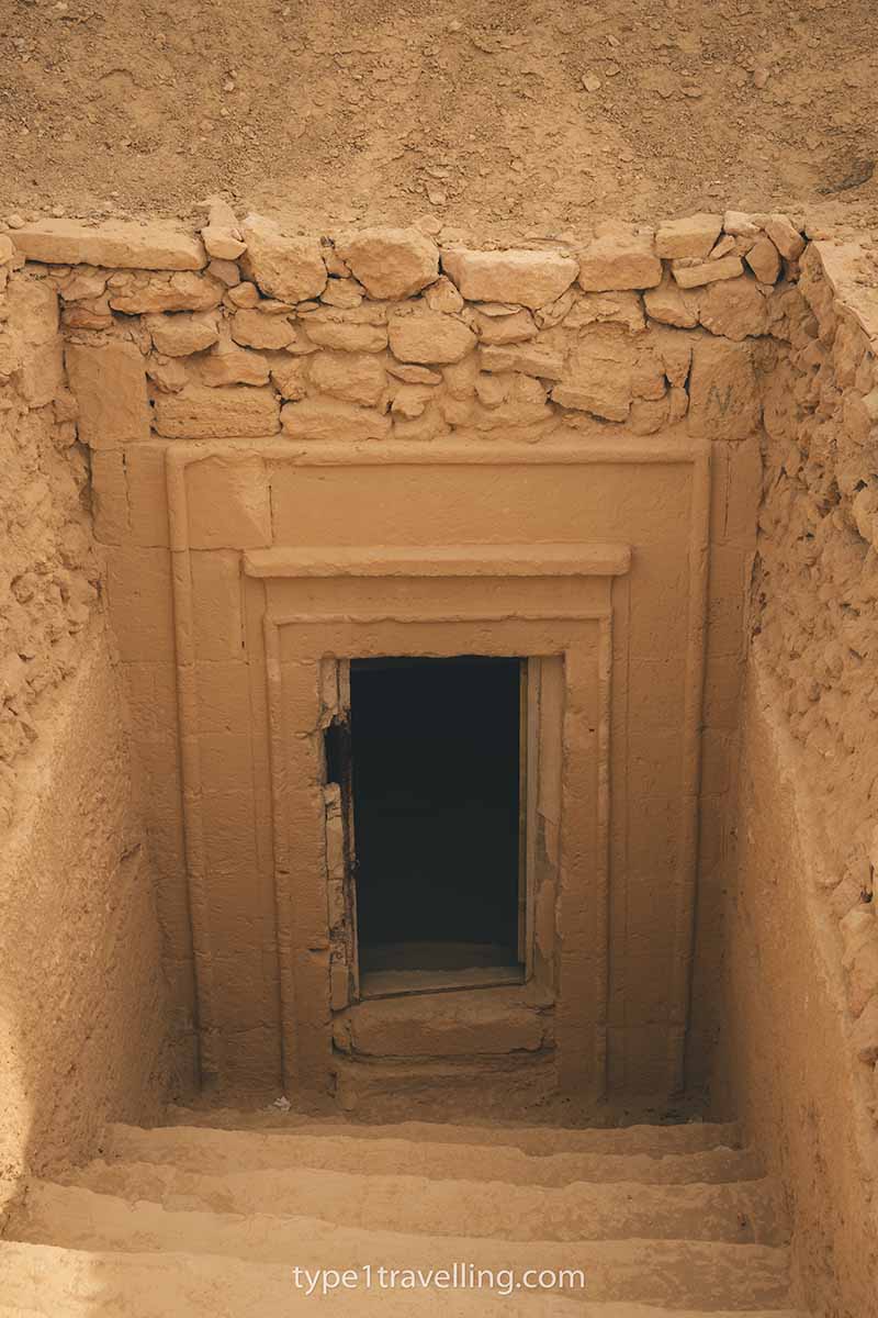 The open entrance to an ancient tomb.