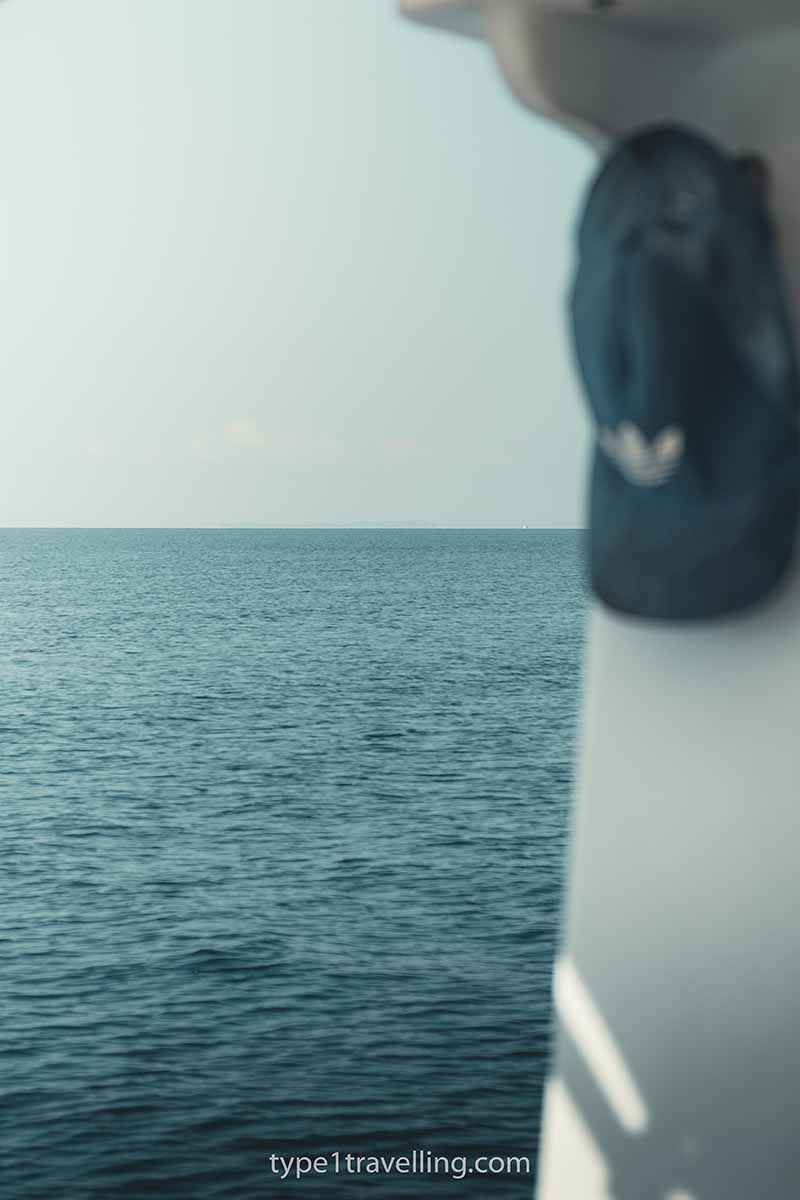 A cap hanging up on a boat on the Ionian Sea.