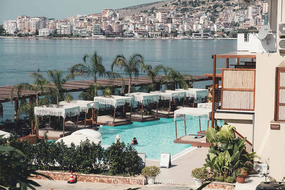 The Lost Seaside swimming pool surrounded by poolside cabanas.