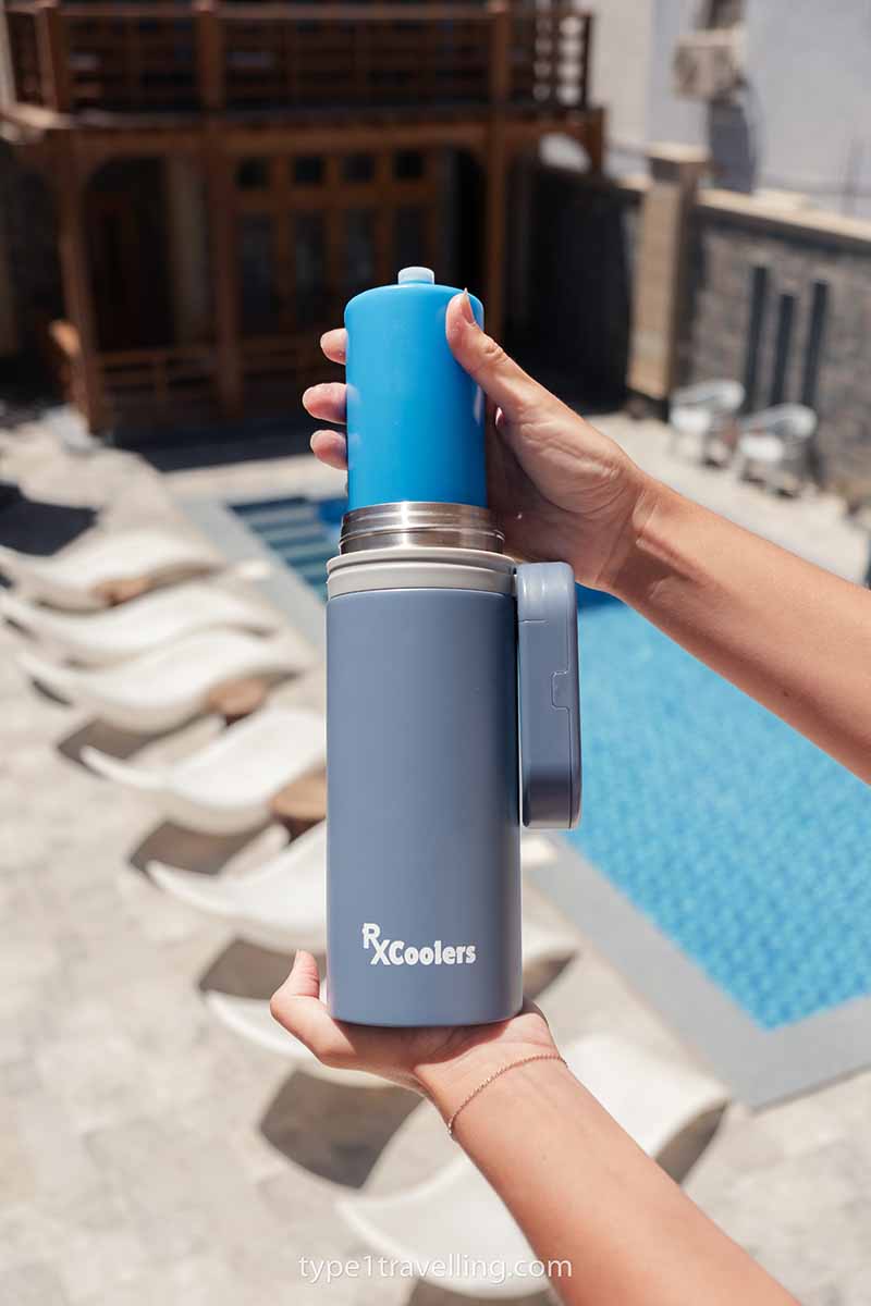 A hand pulling a BioGel Ice Pack out from an RXCoolers Max insulin cooler.