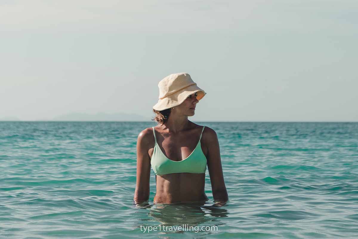 chaloklum-beach-swimming Lucy waist-deep in the turquoise sea at Chaloklum Beach.